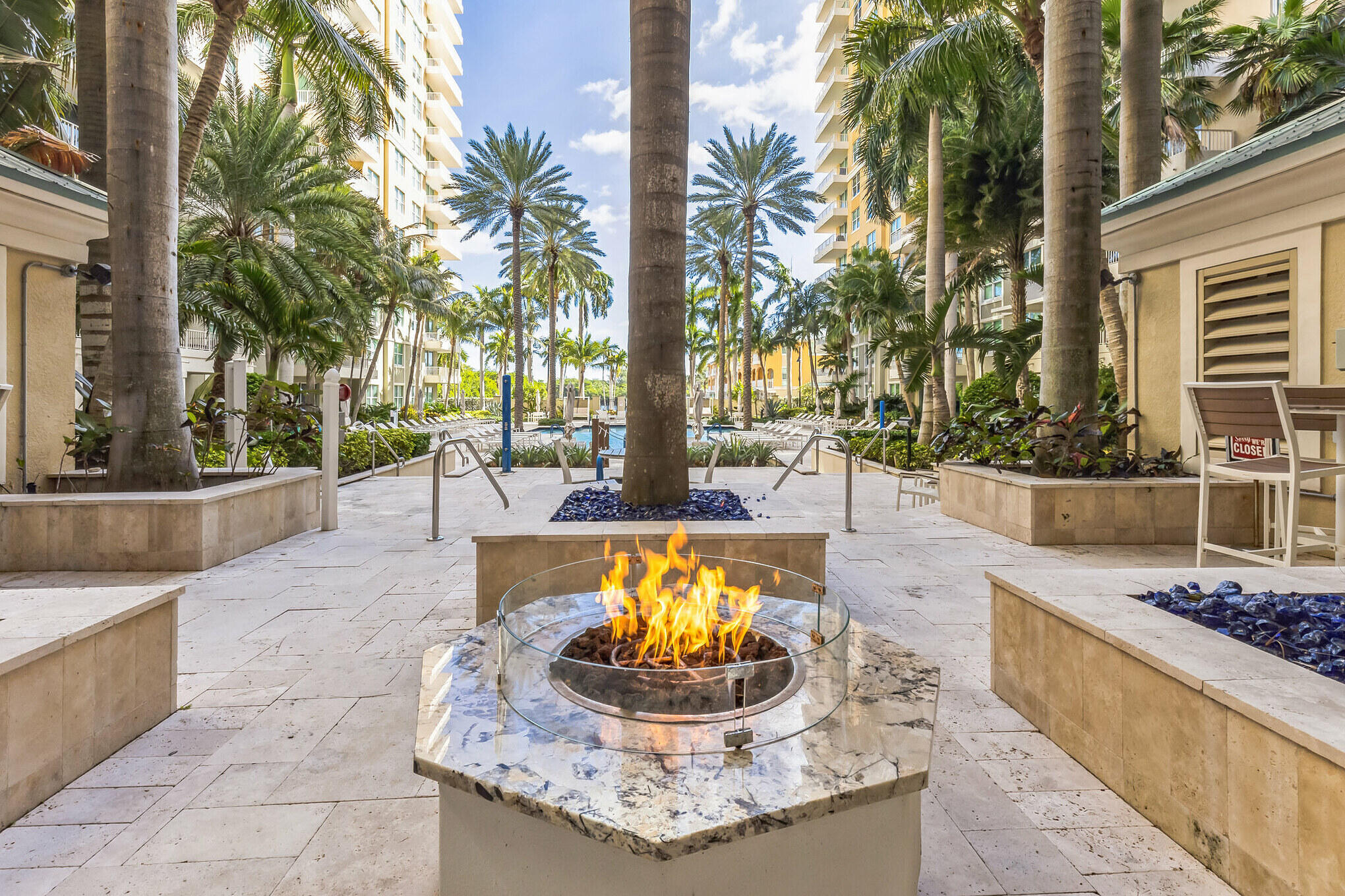 700 East Boynton Beach Boulevard, Unit 511 Boynton Beach, FL 33435 - Photo 23 of 37 a swimming pool with outdoor seating and a patio