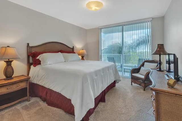 a bedroom with bed and window