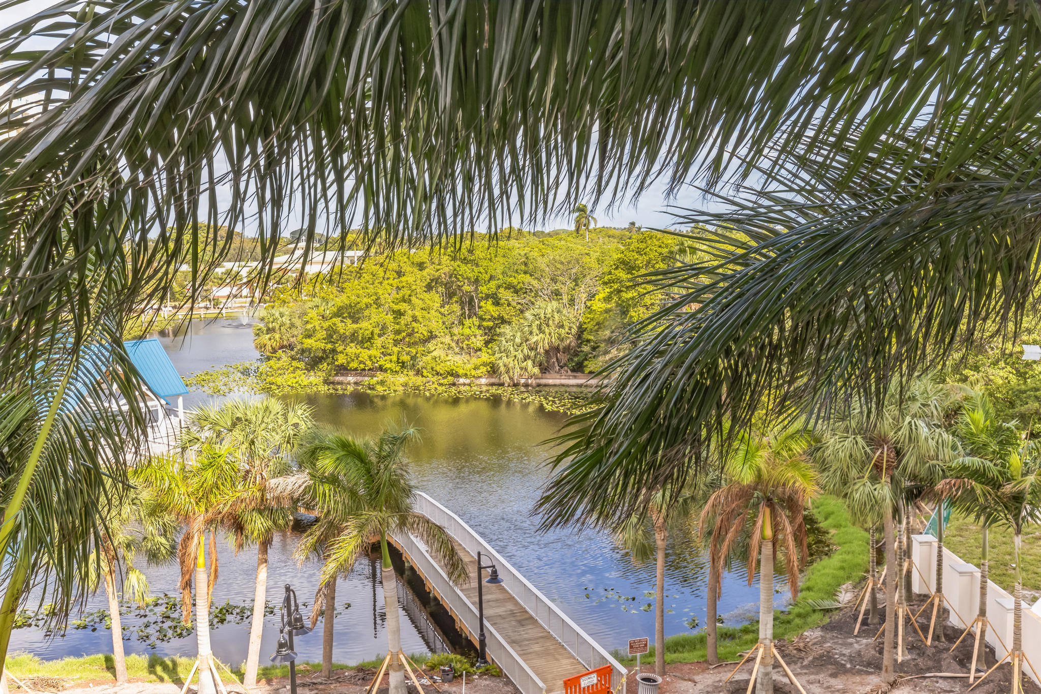 700 East Boynton Beach Boulevard, Unit 511 Boynton Beach, FL 33435 - Photo 3 of 37 a view of swimming pool from a garden