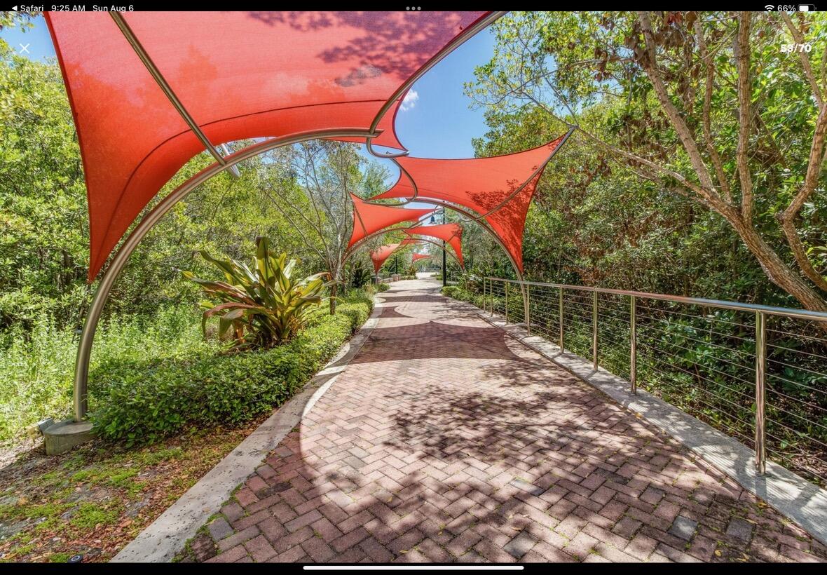700 East Boynton Beach Boulevard, Unit 511 Boynton Beach, FL 33435 - Photo 32 of 37 a view of a pathway with a building in the background