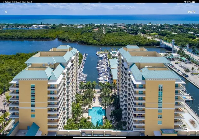 an aerial view of residential building and lake