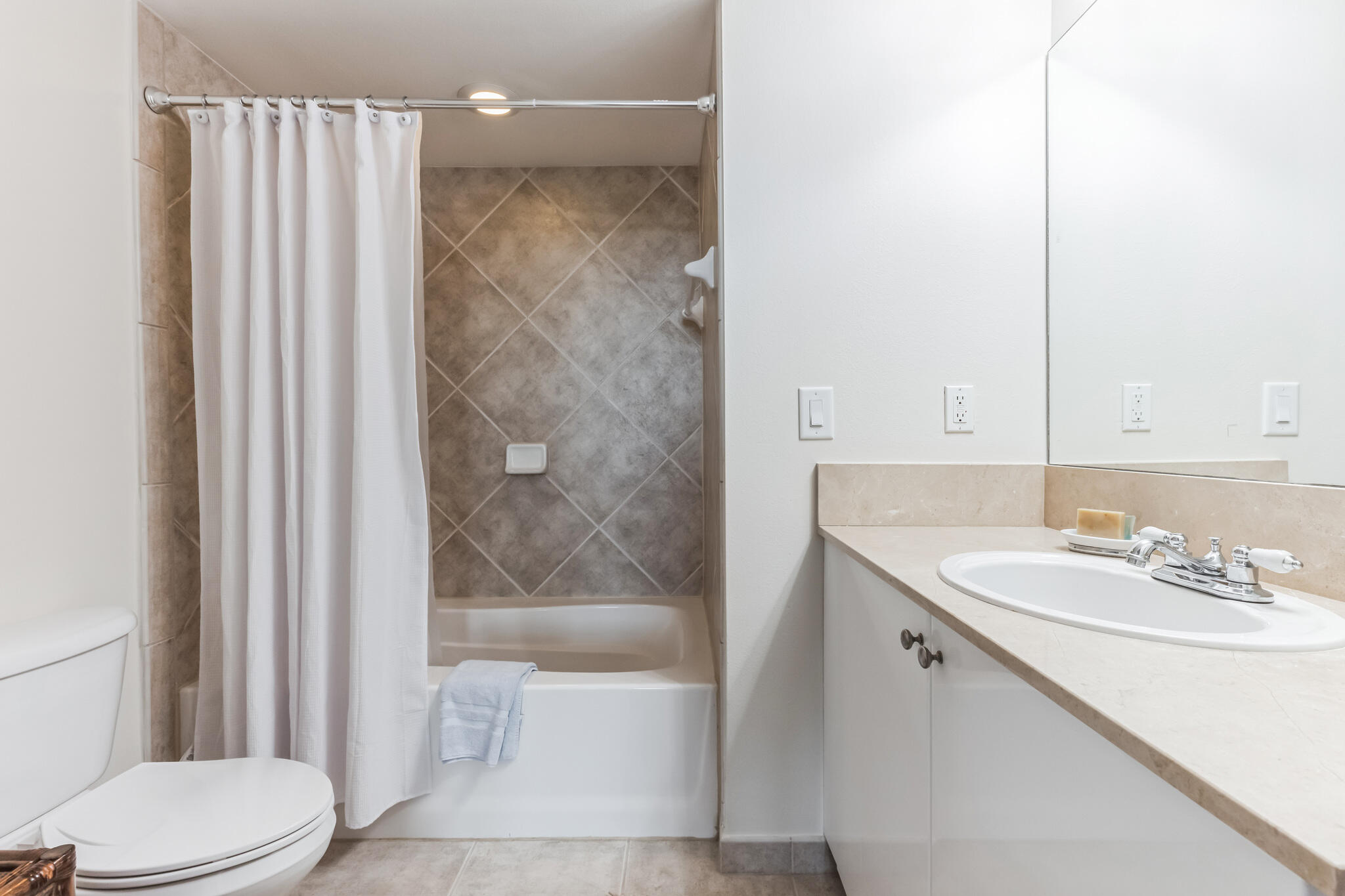 700 East Boynton Beach Boulevard, Unit 511 Boynton Beach, FL 33435 - Photo 8 of 37 a bathroom with a sink a toilet and shower