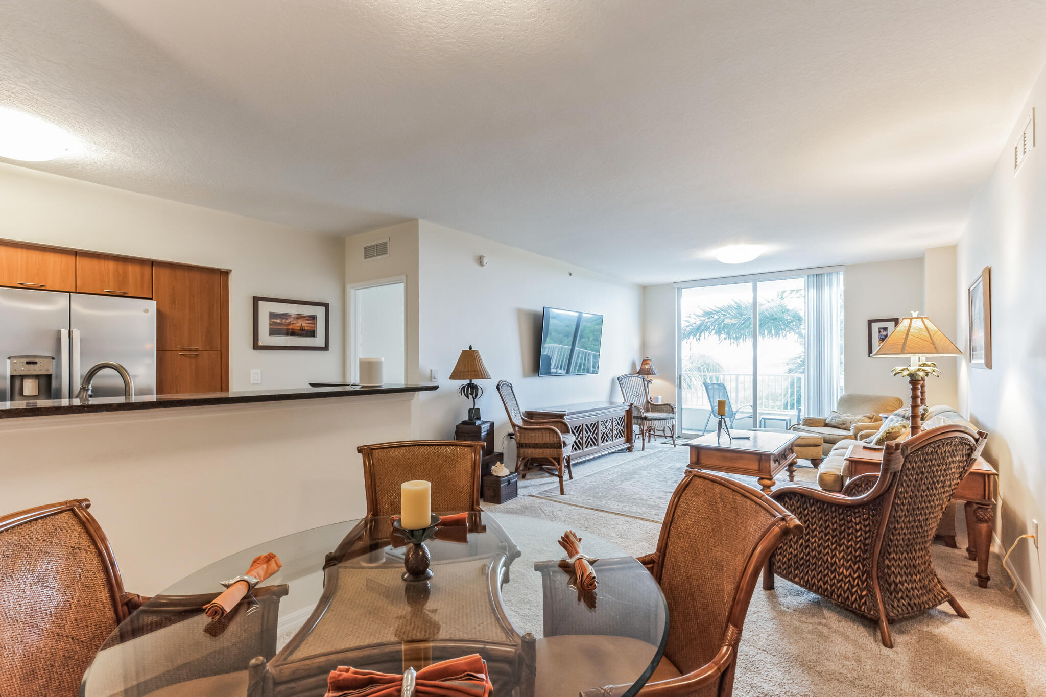 700 East Boynton Beach Boulevard, Unit 511 Boynton Beach, FL 33435 - Photo 10 of 37 a living room with furniture a large window and gym equipment