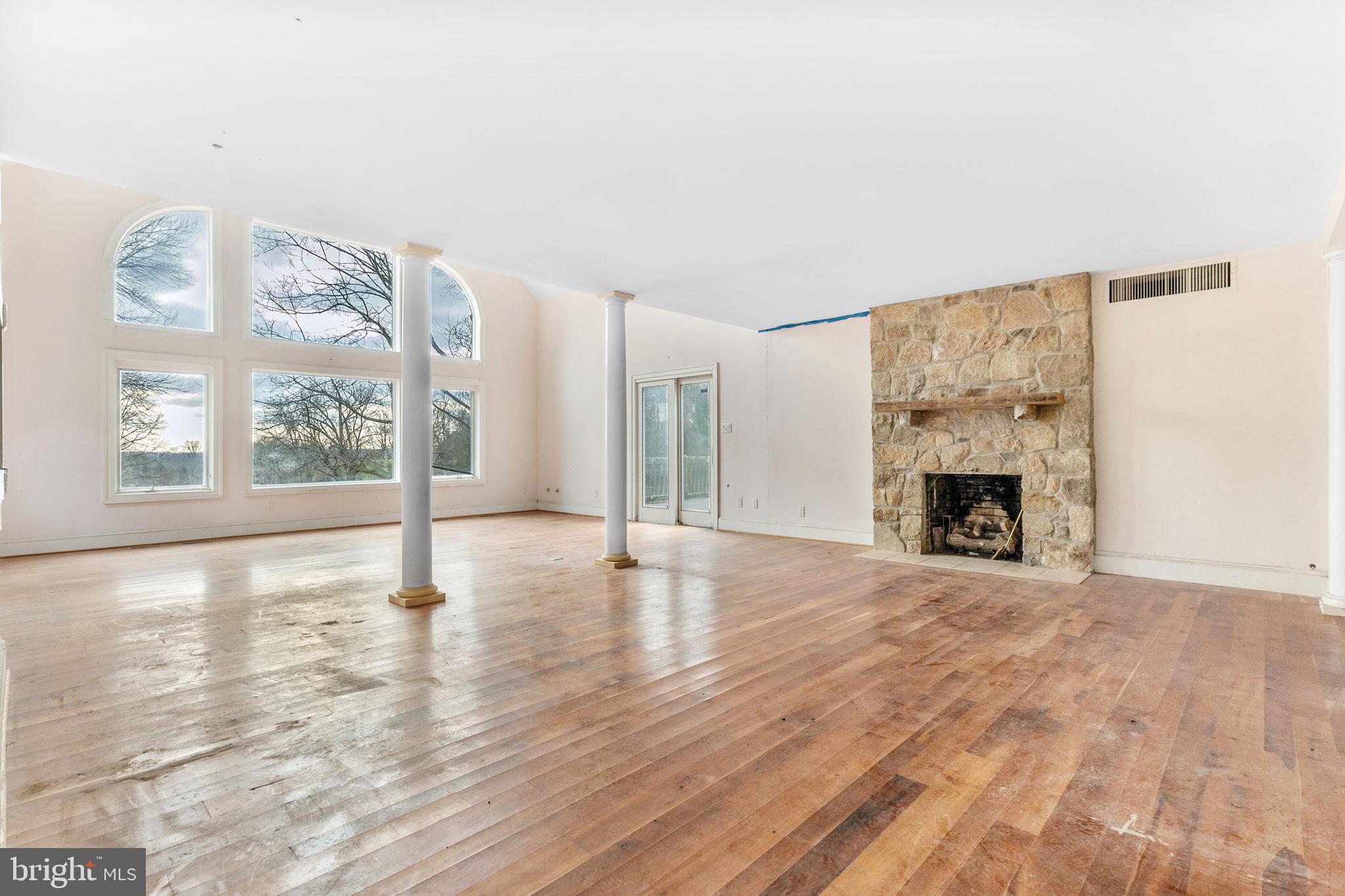 9 Walnut Ridge Road Wilmington, DE 19807 - Photo 17 of 48 a view of an empty room with a fireplace and a window