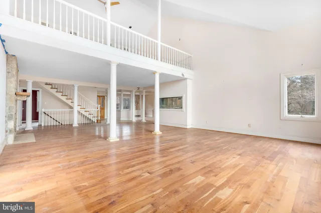 a view of an entryway with wooden floor