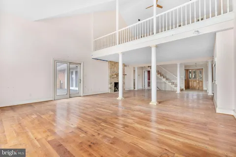 a view of an entryway with wooden floor