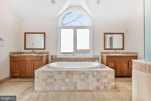 a bathroom with a tub and shower