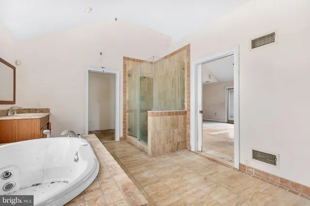 a bathroom with a shower and a toilet