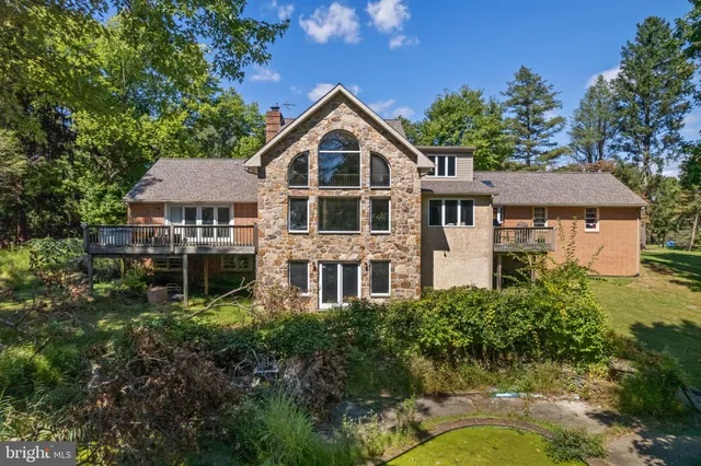 an aerial view of a house with a yard balcony