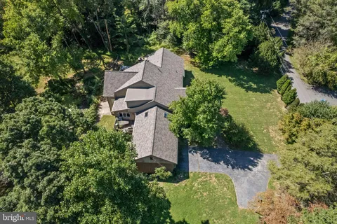 an aerial view of a house with a garden