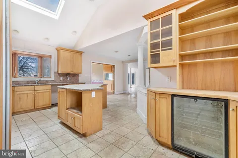 a kitchen with a stove a sink and a refrigerator