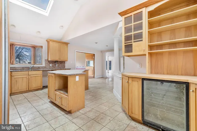 a kitchen with a stove a sink and a refrigerator