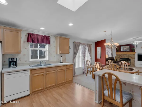 a very nice looking living room with a large window and furniture