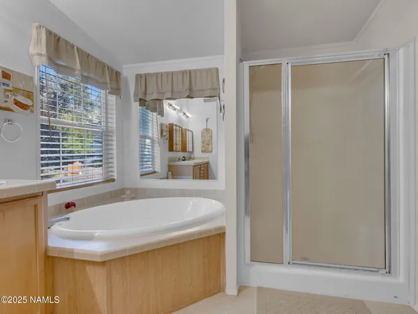 a bathroom with bathtub and window