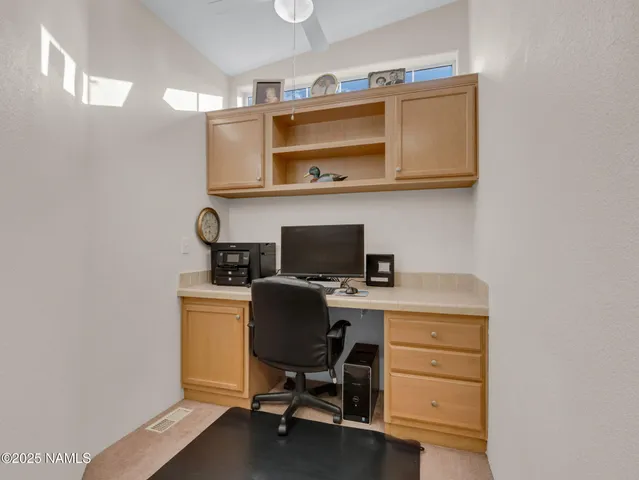 a view of a workspace with furniture