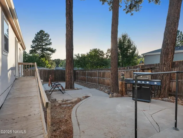 a view of roof deck with chairs