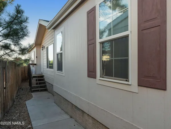 a view of house with backyard