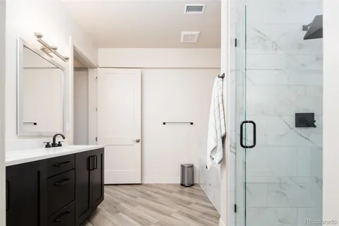 a bathroom with a sink a mirror and a bathtub