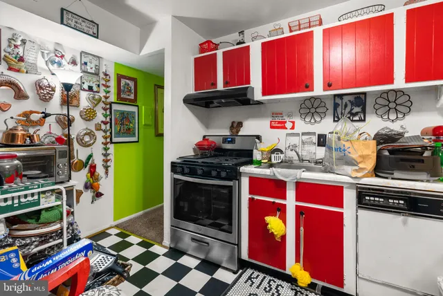 a kitchen with lots of appliances and cabinets