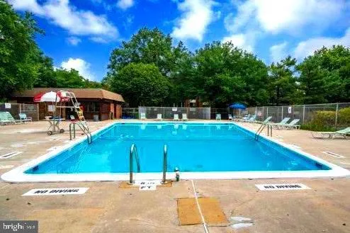 a view of a swimming pool with a patio
