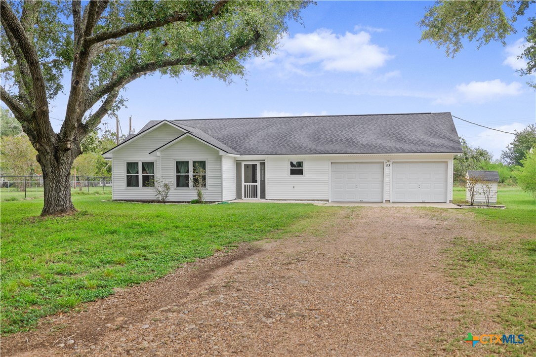 83 Lakeoak Victoria, TX 77905 - Photo 4 of 16 a front view of a house with a yard and garage