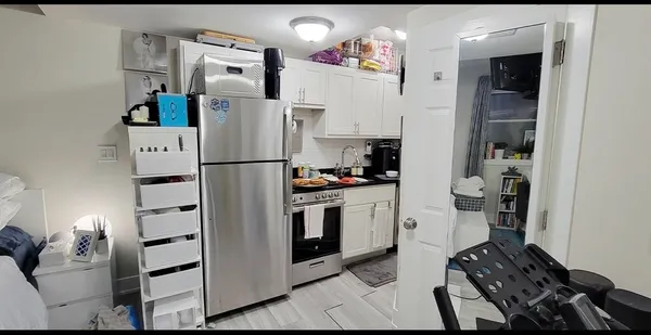a close view of a sink and cabinets