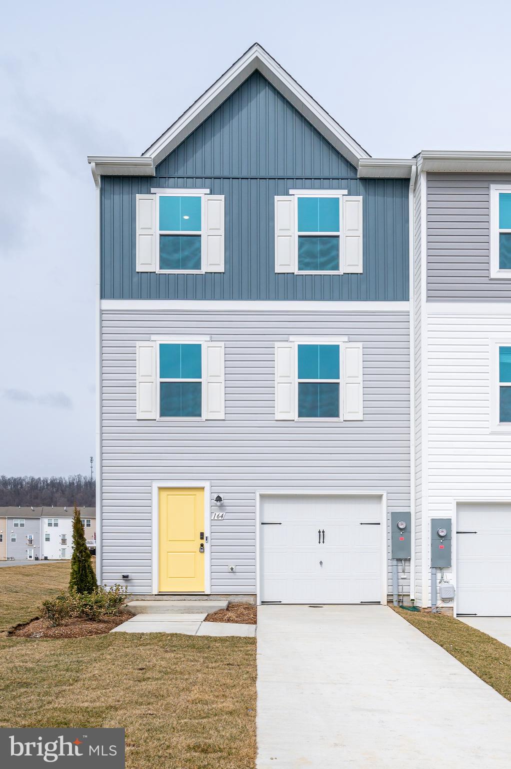 164 Rabbit Road Hedgesville, WV 25427 - Photo 2 of 41 a front view of a house with a yard