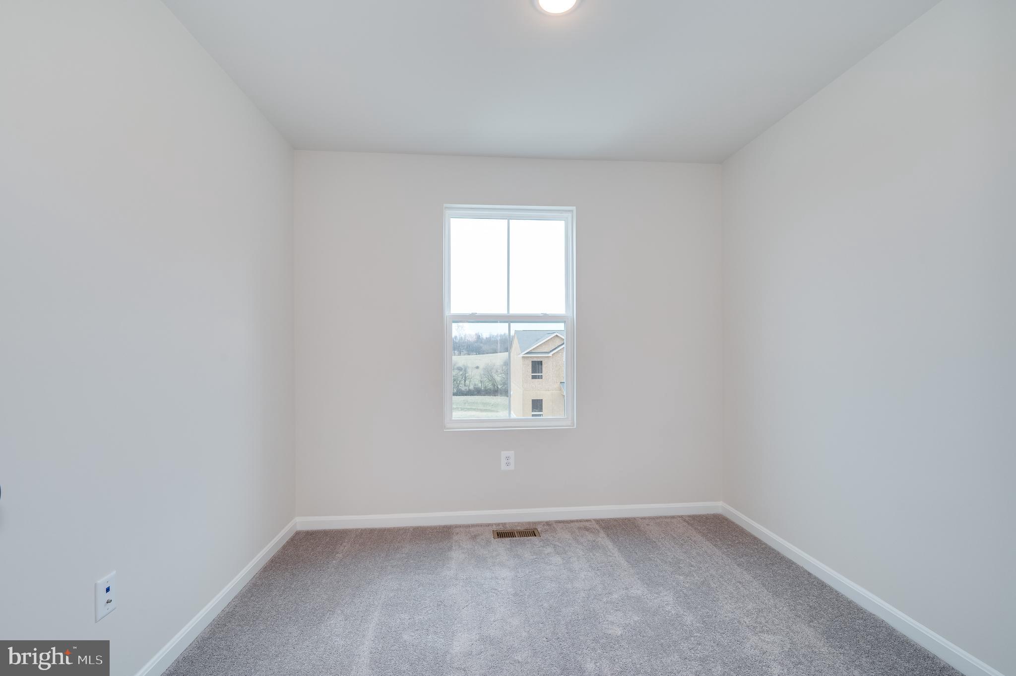 164 Rabbit Road Hedgesville, WV 25427 - Photo 32 of 41 an empty room with a window