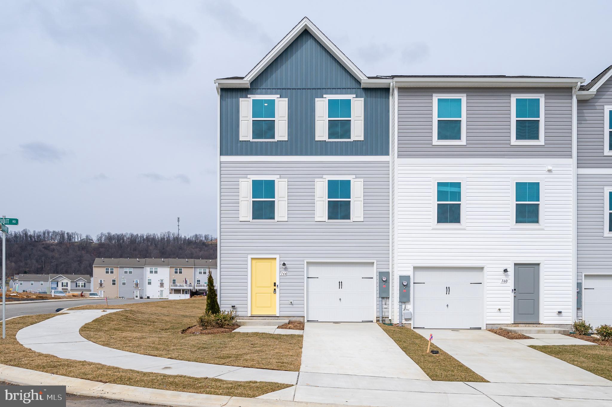 164 Rabbit Road Hedgesville, WV 25427 - Photo 5 of 41 a front view of a house with a yard