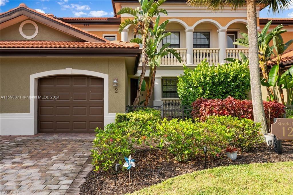 1276 Strada Milan Lane, Unit 2 Naples, FL 34105 - Photo 1 of 36 a front view of a house