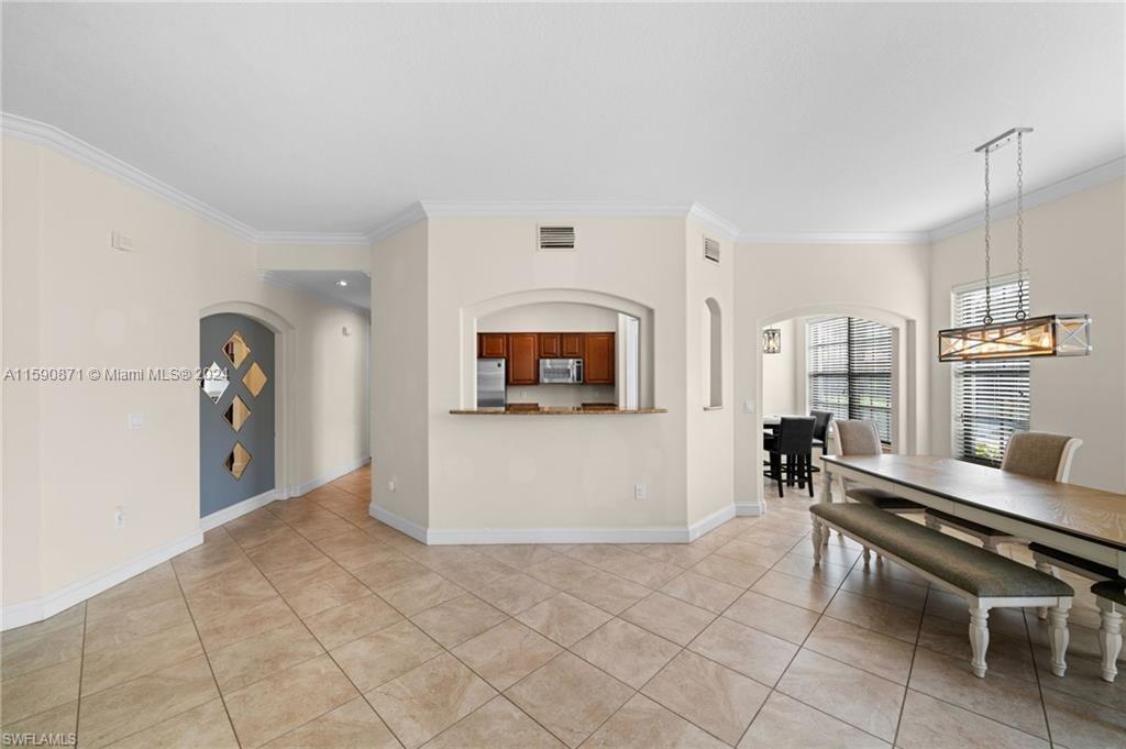 1276 Strada Milan Lane, Unit 2 Naples, FL 34105 - Photo 13 of 36 a living room with furniture