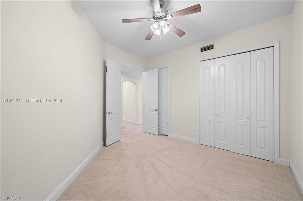 1276 Strada Milan Lane, Unit 2 Naples, FL 34105 - Photo 23 of 36 a view of an empty room