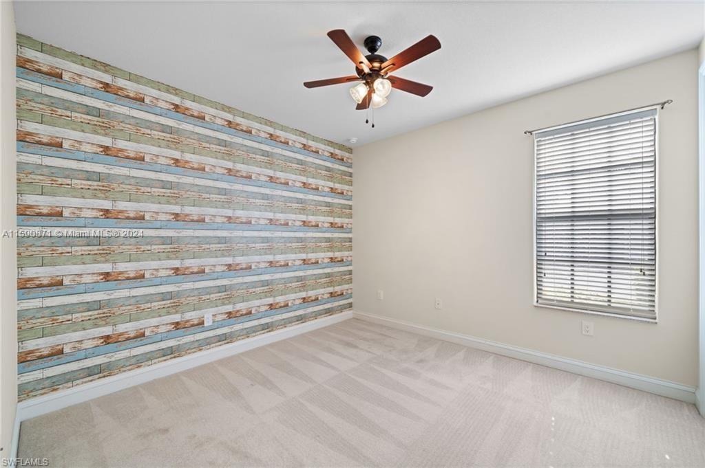1276 Strada Milan Lane, Unit 2 Naples, FL 34105 - Photo 25 of 36 a view of room with window and ceiling fan