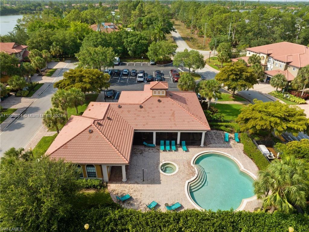 1276 Strada Milan Lane, Unit 2 Naples, FL 34105 - Photo 33 of 36 an aerial view of a house with swimming pool and outdoor seating