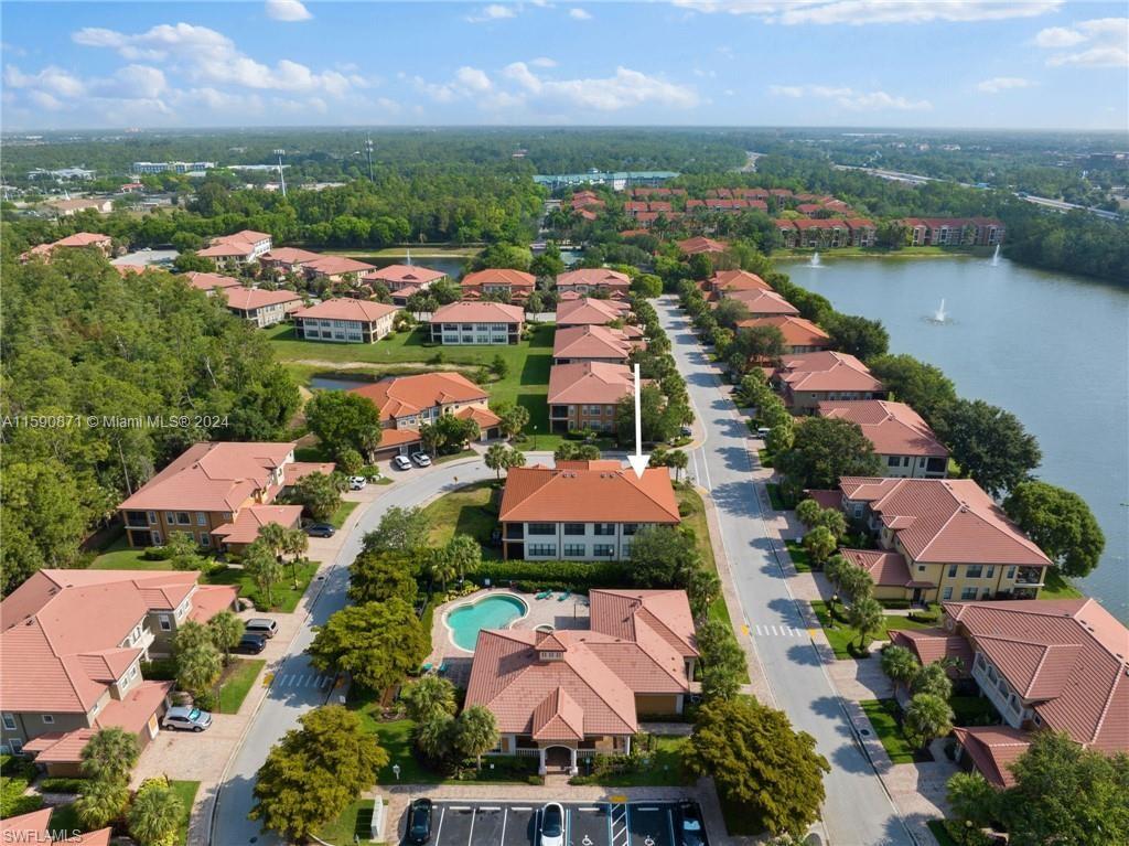 1276 Strada Milan Lane, Unit 2 Naples, FL 34105 - Photo 34 of 36 an aerial view of residential houses with outdoor space