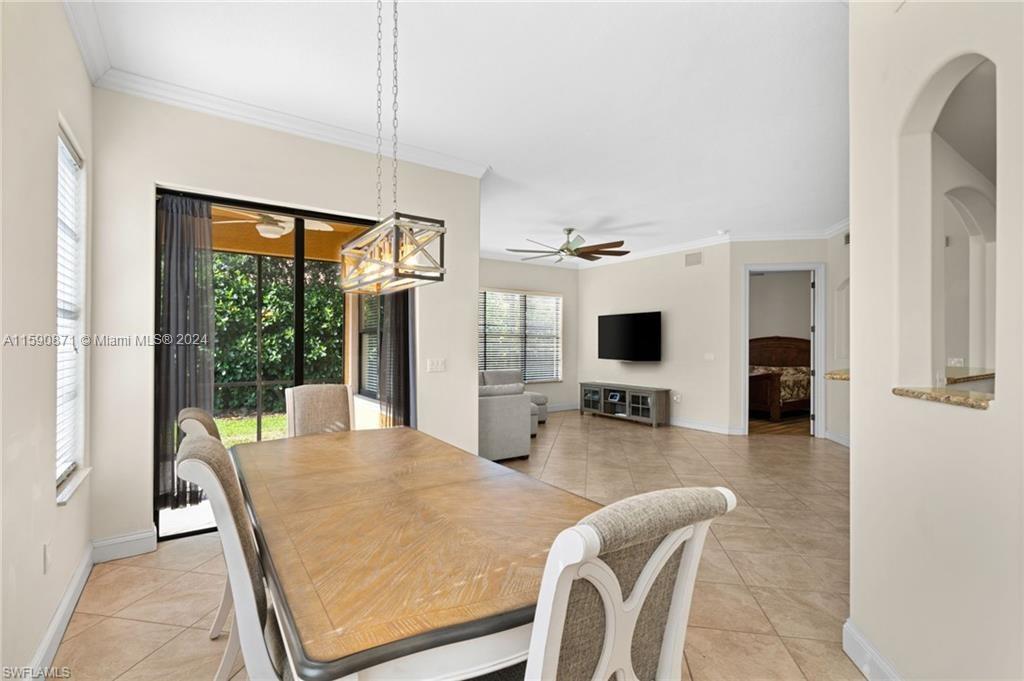 1276 Strada Milan Lane, Unit 2 Naples, FL 34105 - Photo 10 of 36 a dining room with furniture and window