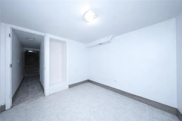 an empty room with a empty space and a window