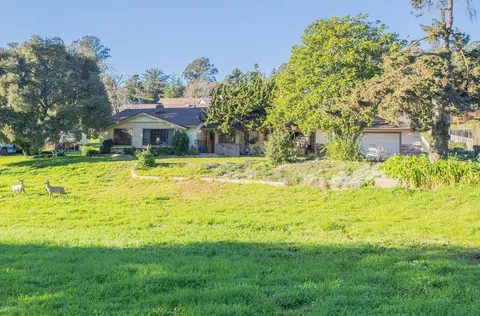 a view of a house with a swimming pool