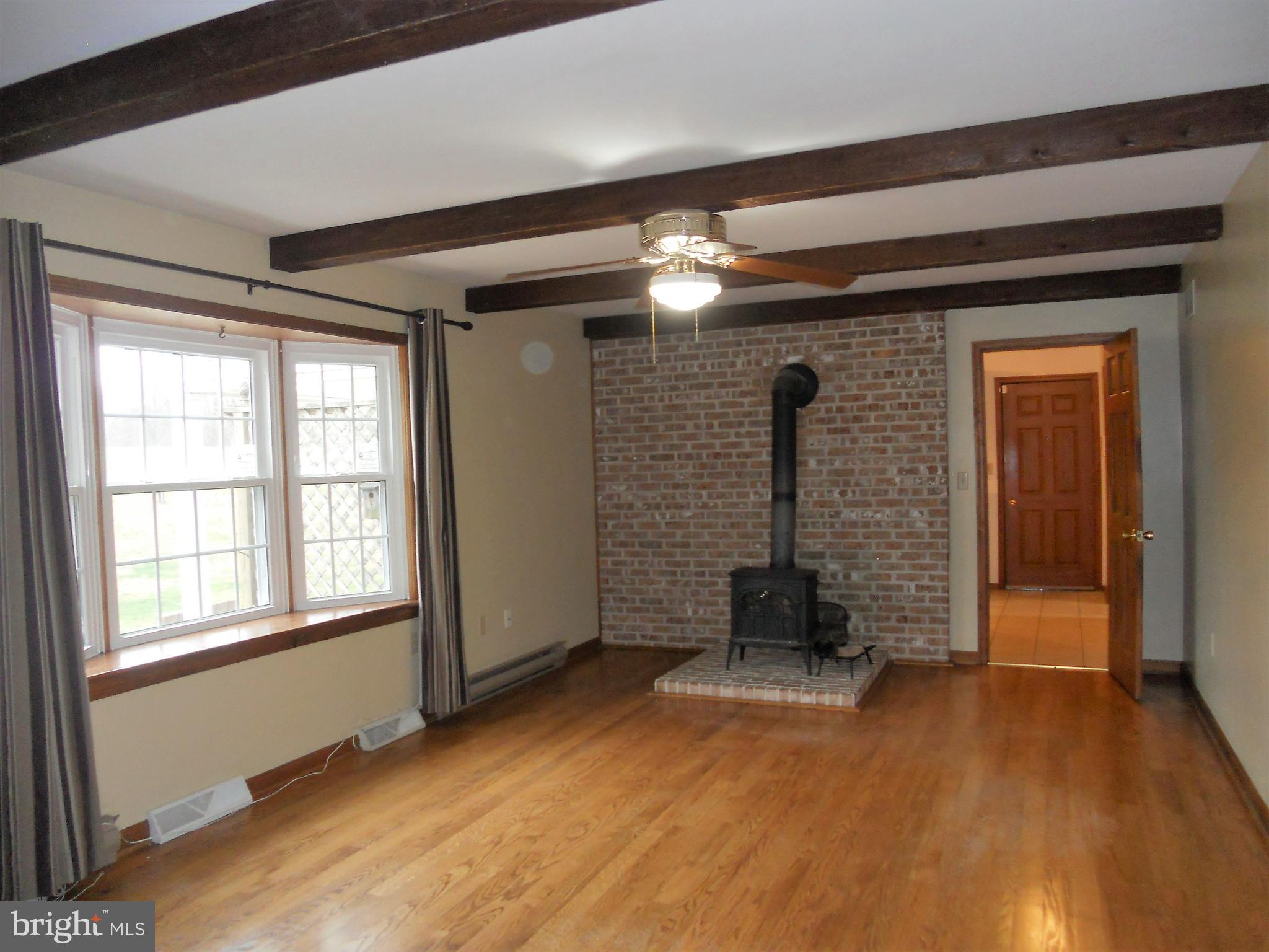 1755 Manchester Road Westminster, MD 21157 - Photo 2 of 38 Main level family rm looks over private rear yard.