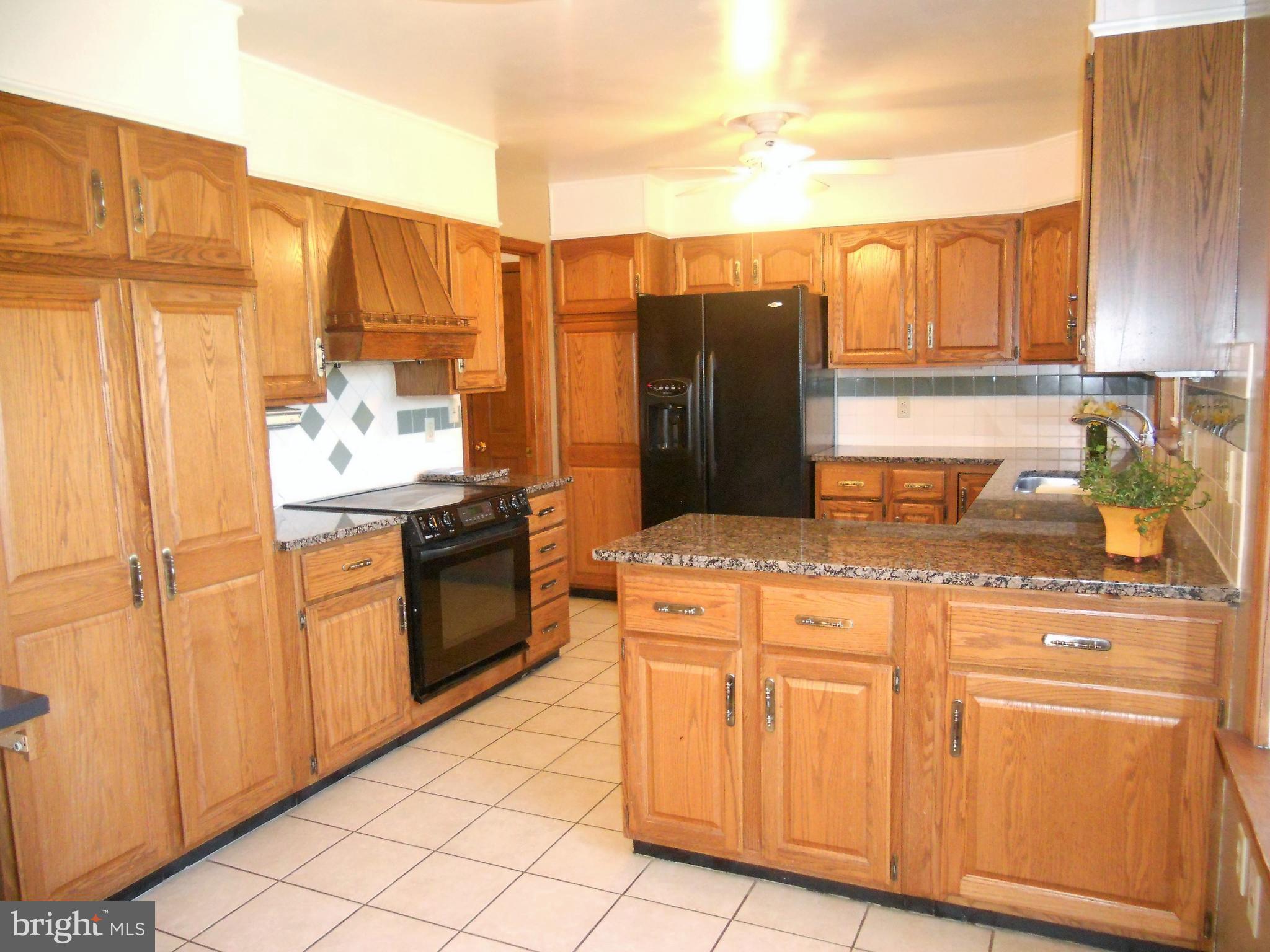1755 Manchester Road Westminster, MD 21157 - Photo 3 of 38 Eat in kitchen has granite counters, ceramic floor