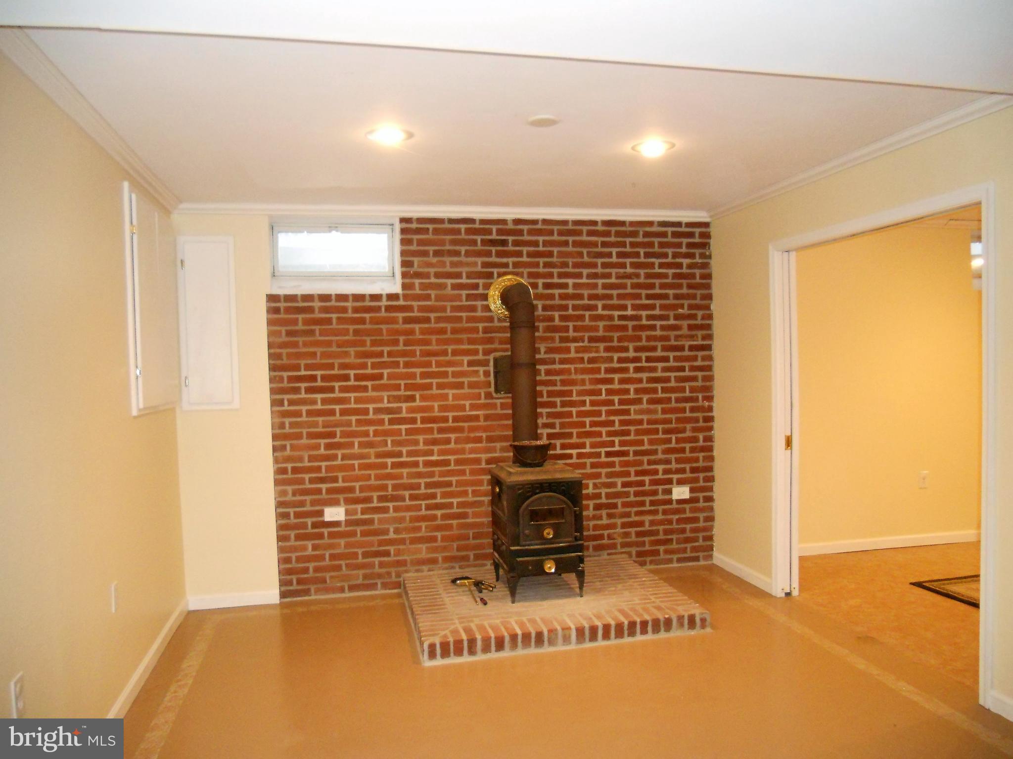 1755 Manchester Road Westminster, MD 21157 - Photo 24 of 38 Third woodstove in finished lower level.