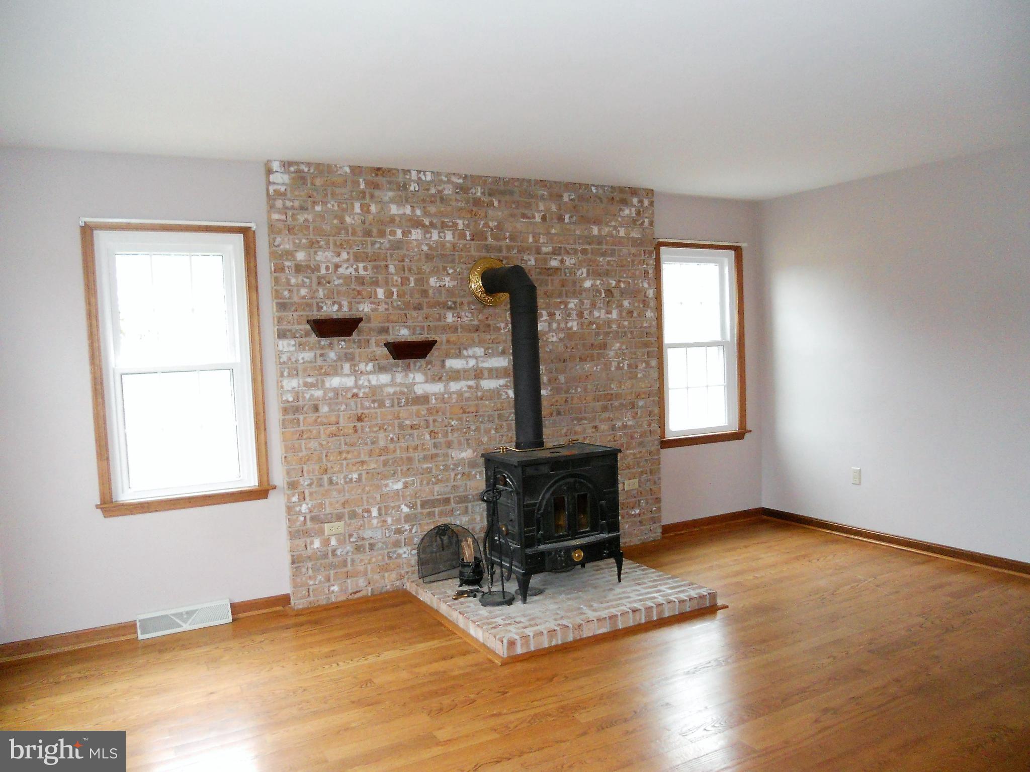 1755 Manchester Road Westminster, MD 21157 - Photo 7 of 38 Cozy living room or den with wood stove.