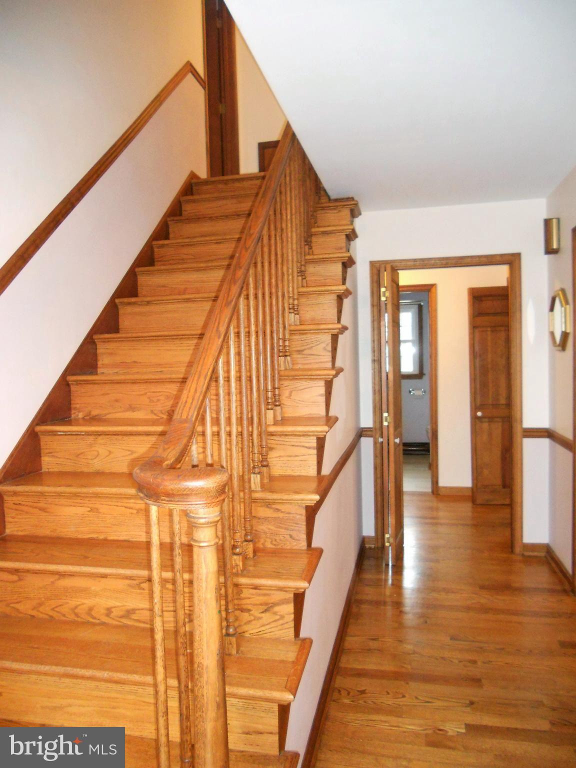 1755 Manchester Road Westminster, MD 21157 - Photo 9 of 38 Front entry with wood stairway, center hall.