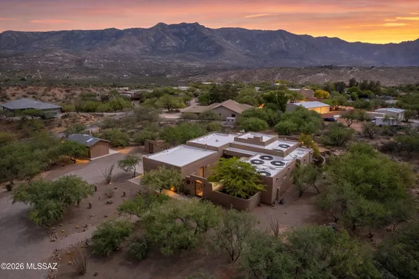 an aerial view of a house with mountain view