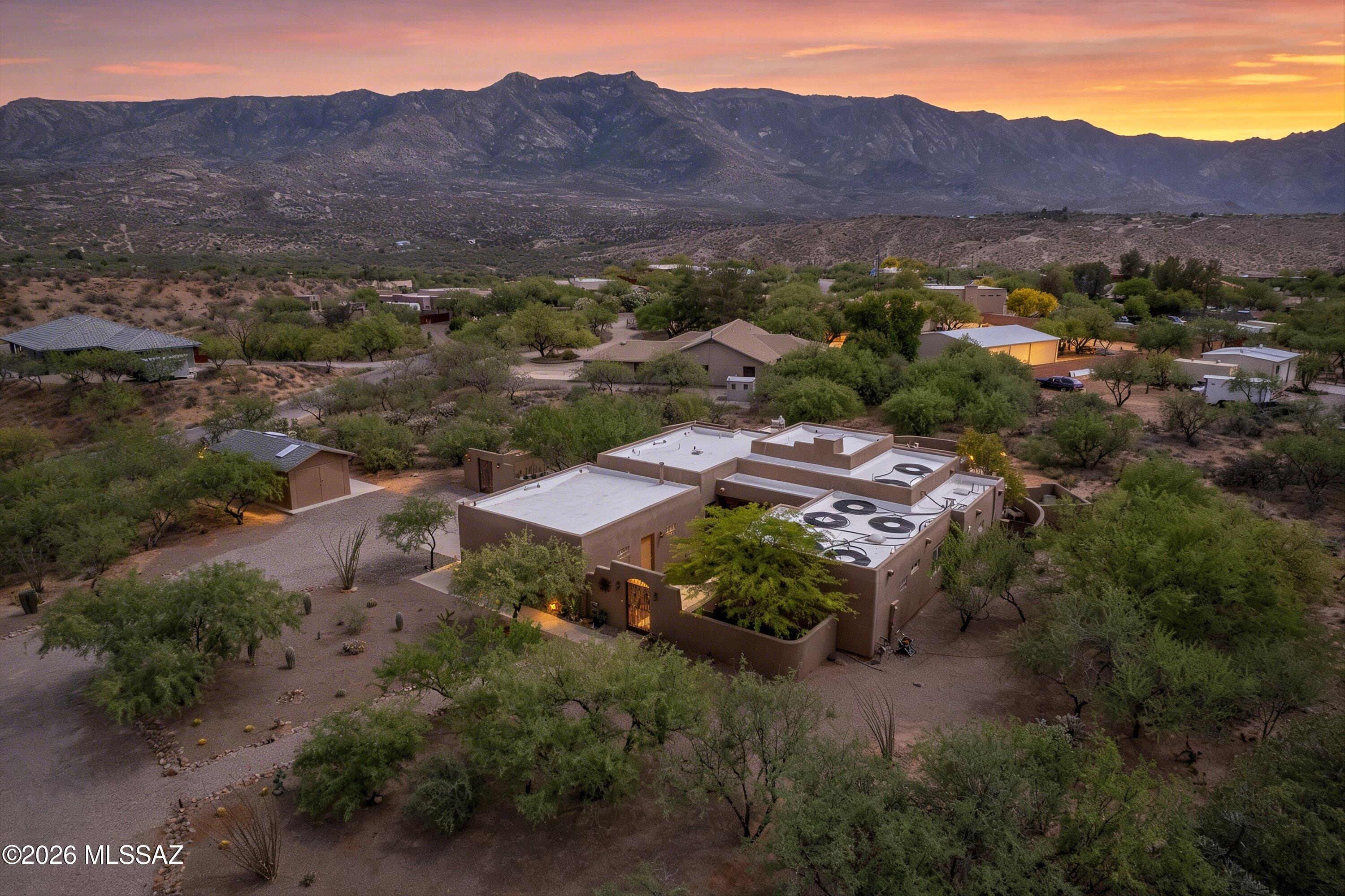 4760 East Wagon Train Road Tucson, AZ 85739 - Photo 1 of 38 an aerial view of a house with mountain view
