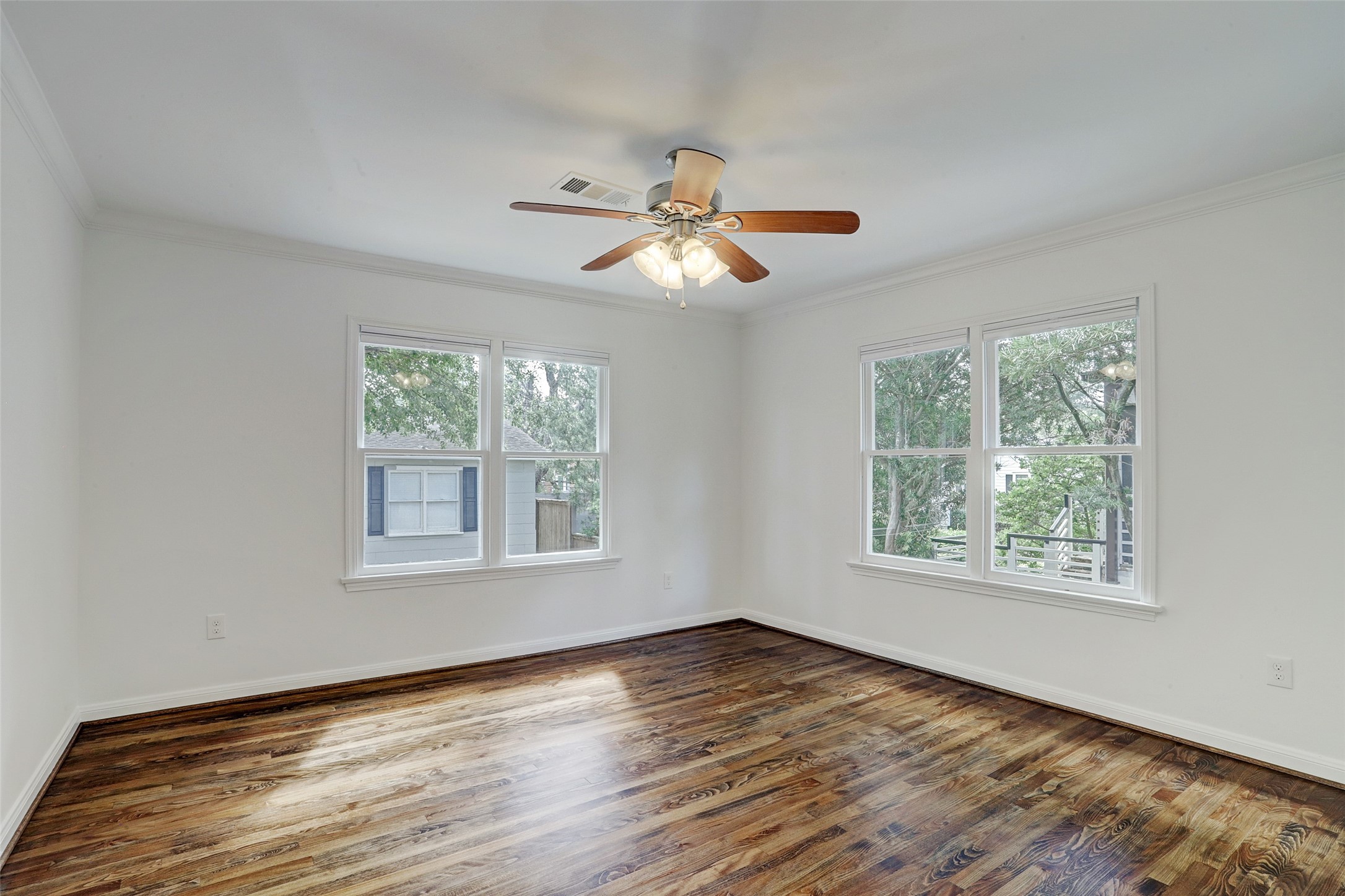 2011 South Boulevard Houston, TX 77098 - Photo 19 of 24 a view of an empty room with wooden floor and a window
