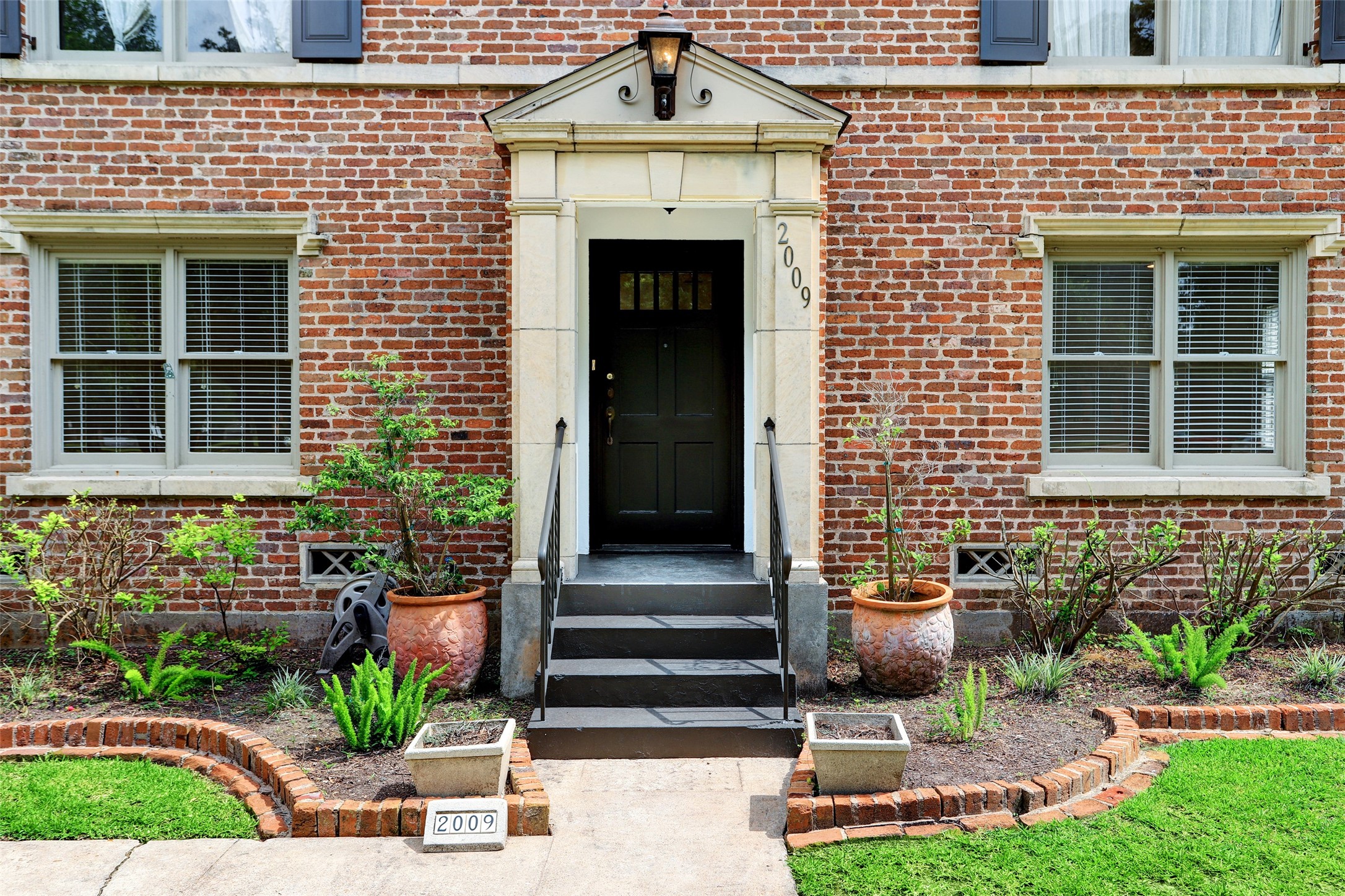 2011 South Boulevard Houston, TX 77098 - Photo 24 of 24 a front view of a house with a yard