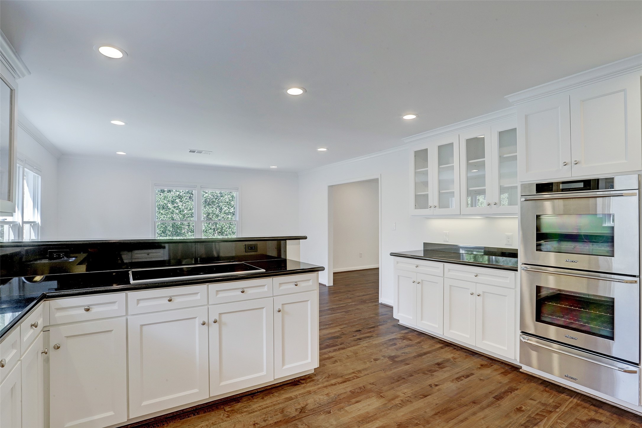 2011 South Boulevard Houston, TX 77098 - Photo 8 of 24 a kitchen with stainless steel appliances granite countertop a stove a sink and a microwave