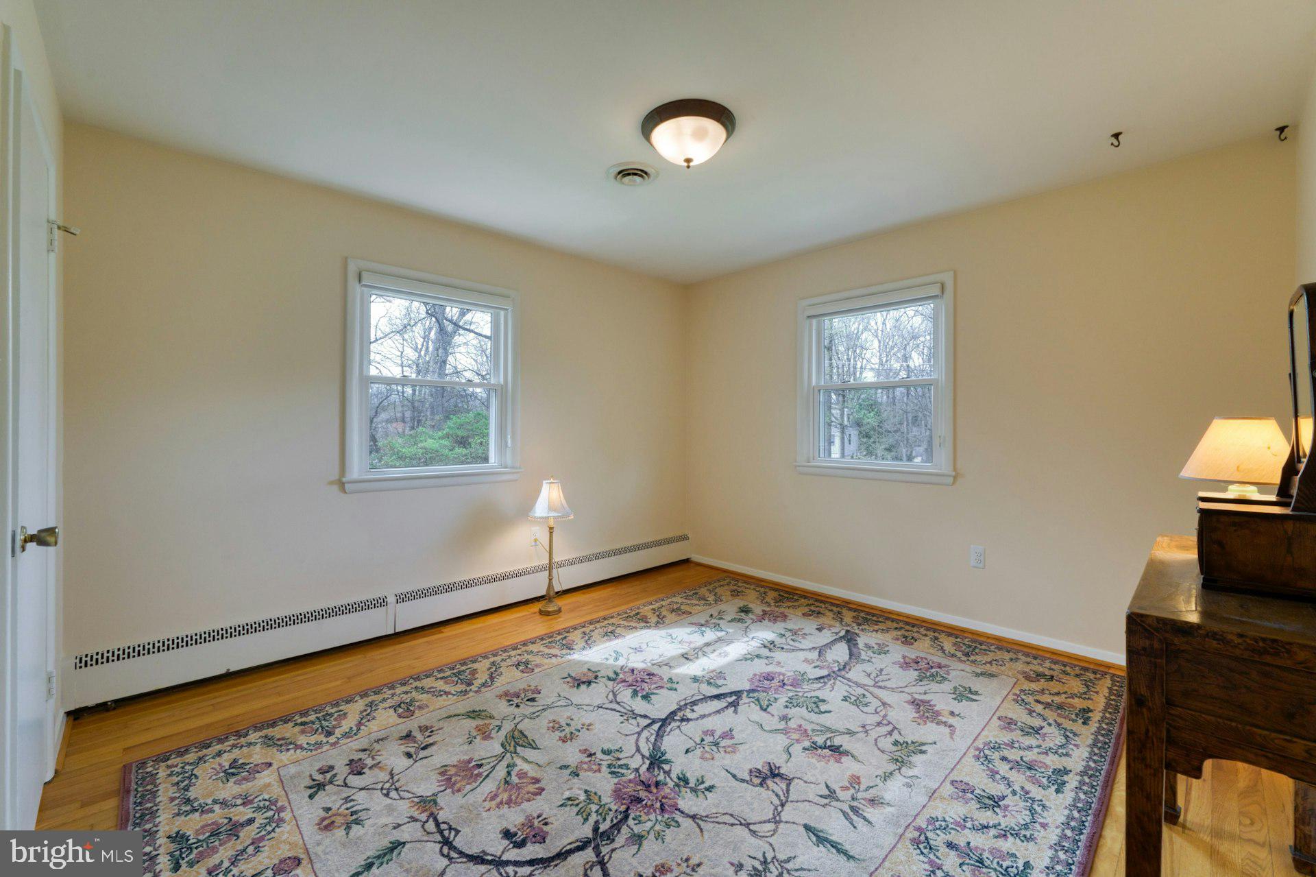 1100 Springvale Road Great Falls, VA 22066 - Photo 34 of 47 a view of empty room with window and wooden floor