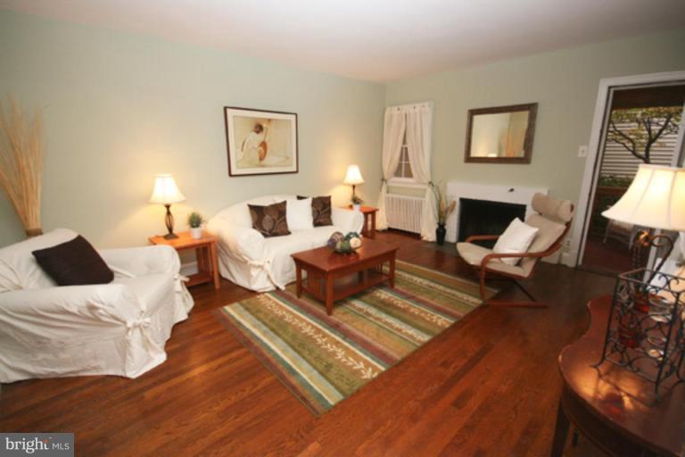 5 Stockton Road Silver Spring, MD 20901 - Photo 3 of 25 a living room with furniture rug and a fireplace
